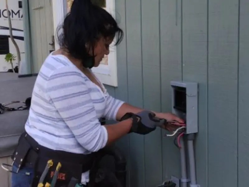 Licensed electrician wiring an exterior subpanel in Redstone